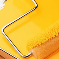 Yellow Paint and a Roller Brush Yellow Paint and a Roller Brush